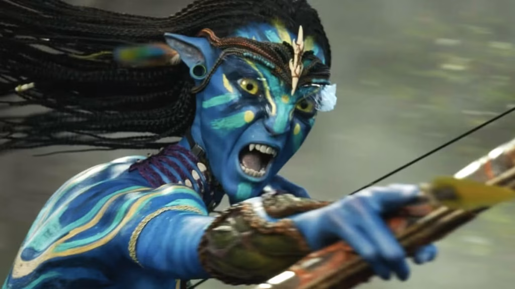 Neytiri, a blue Na’vi woman with braided hair, screams while aiming a drawn bow, her arm extended as she prepares to fire in an action scene.