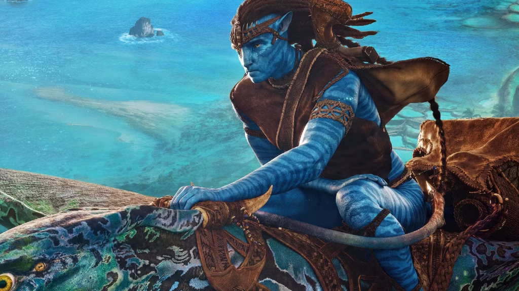 Jake Sully in his Na’vi body crouches on a skimwing sea creature as it speeds over bright turquoise ocean water.