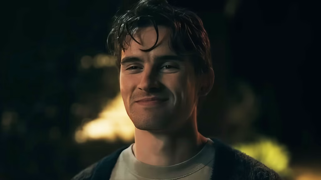 Bear smiles during a nighttime outdoor scene in Obsession.