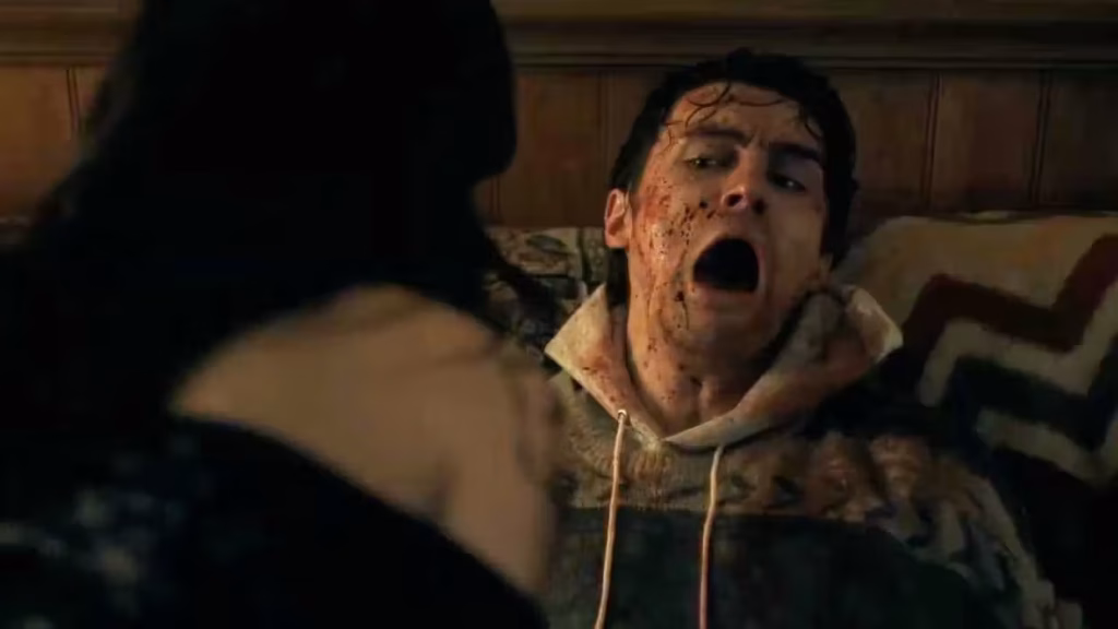 A bloodied Bear recoils in fear as Nikki confronts him in Obsession.